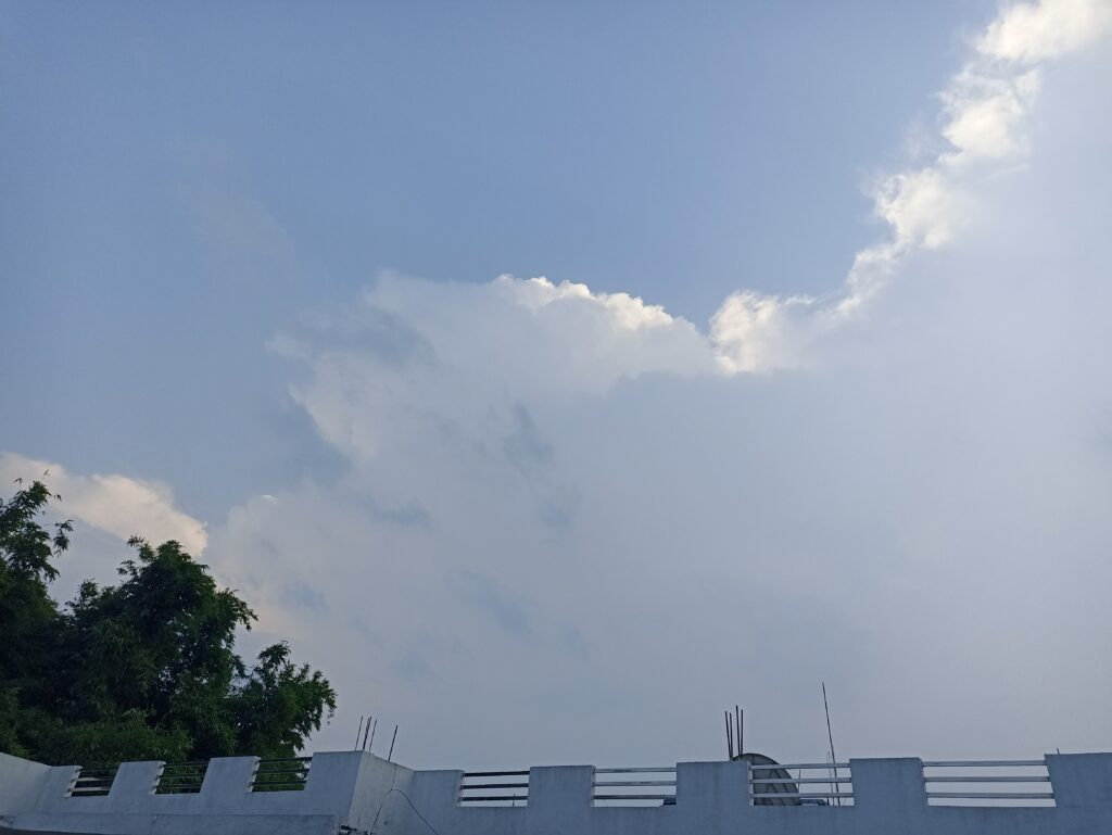 The dark clouds seemed to hang low above the green bamboo and trees surrounding our neighbourhood