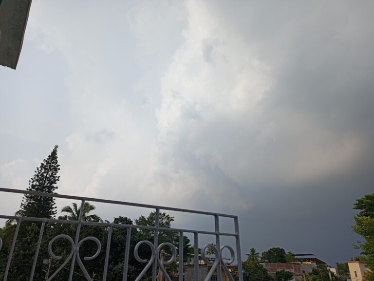 Silver-lined monsoon cloud drifting away after bypassing my rooftop in Birpur.